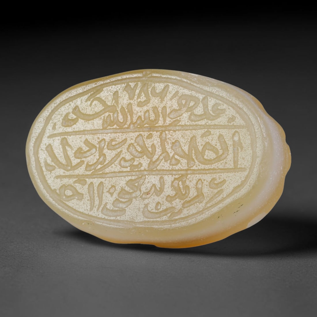 Antique Islamic Qajar / Late Ottoman Agate Calligraphic Talisman Seal (1700-1900 CE), 98FP: Genuine fully hand-carved oval agate seal, entirely crafted by hand without machine tooling, identifiable by organic, uneven hand-cut engraving texture throughout the calligraphic field. The stone bea