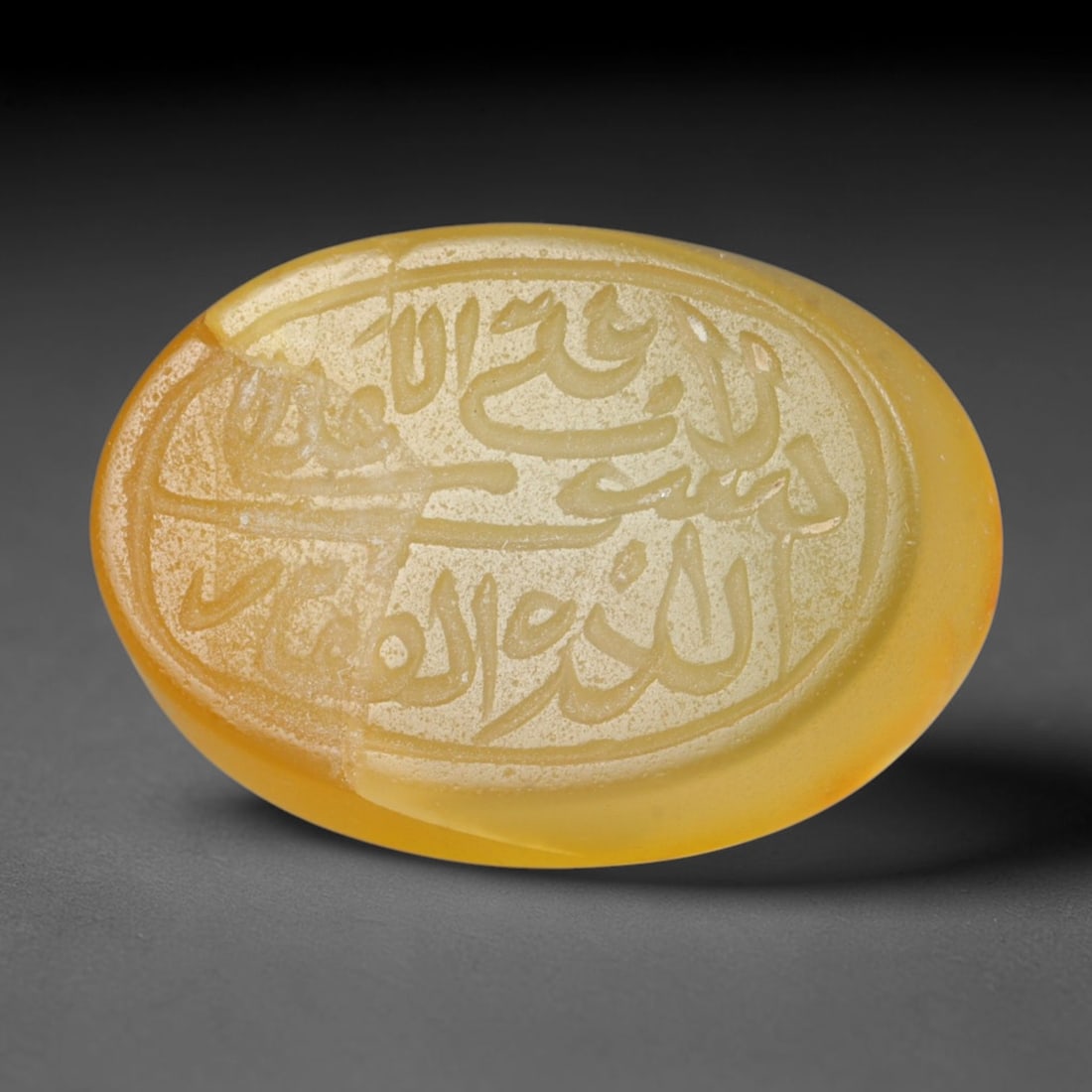 Antique Islamic Qajar / Late Ottoman Agate Calligraphic Talisman Seal (1700-1900 CE), 77FP: Genuine fully hand-carved oval agate seal, entirely crafted by hand without machine tooling, identifiable by organic, uneven hand-cut engraving texture throughout the calligraphic field. The stone bea