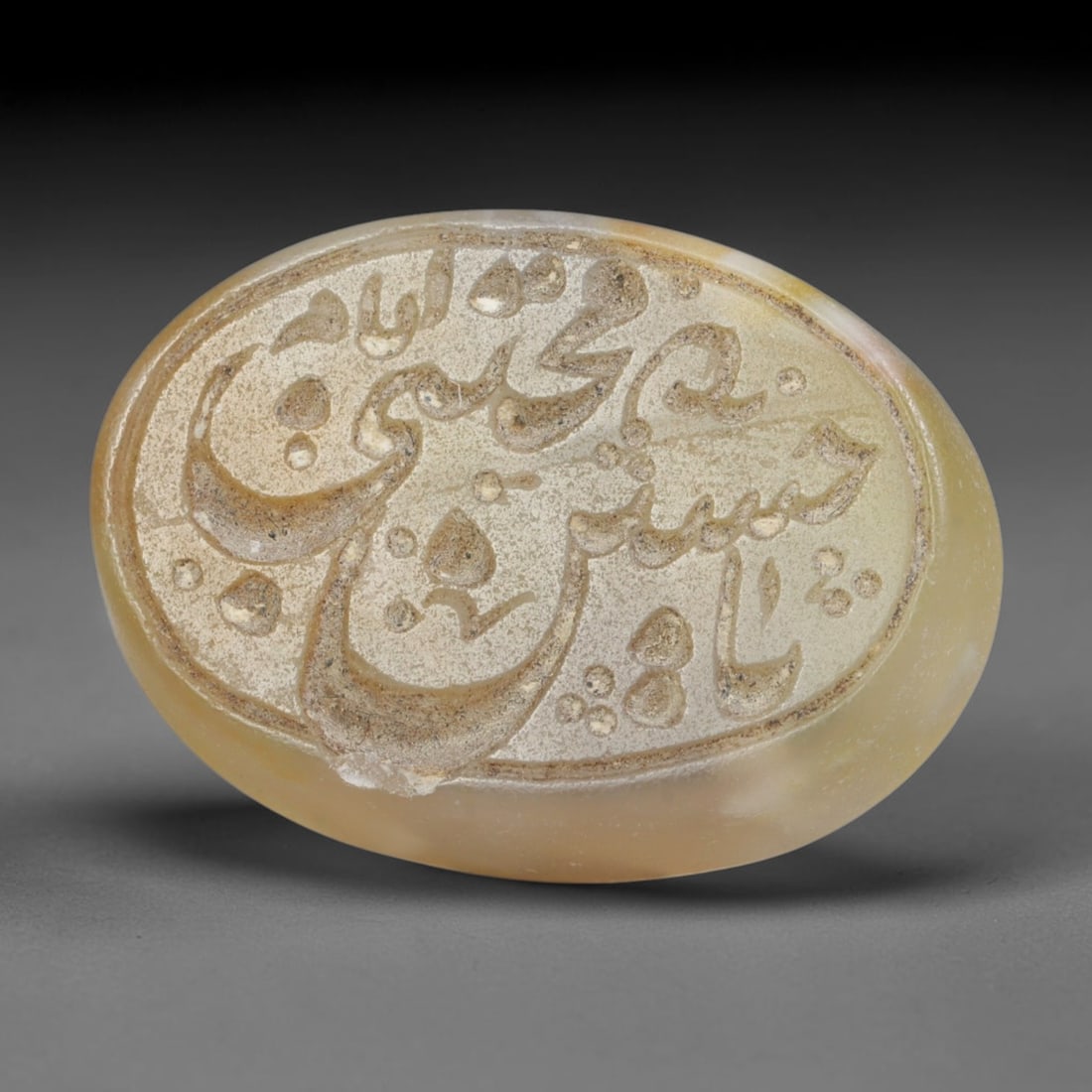 Antique Islamic Qajar / Late Ottoman Agate Calligraphic Talisman Seal (1700-1900 CE), 86FP: Genuine fully hand-carved oval agate seal, entirely crafted by hand without machine tooling, identifiable by organic, uneven hand-cut engraving texture throughout the calligraphic field. The stone bea