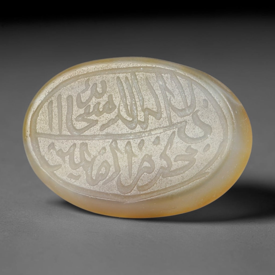 Antique Islamic Qajar / Late Ottoman Agate Calligraphic Talisman Seal (1700-1900 CE), 85FP: Genuine fully hand-carved oval agate seal, entirely crafted by hand without machine tooling, identifiable by organic, uneven hand-cut engraving texture throughout the calligraphic field. The stone bea