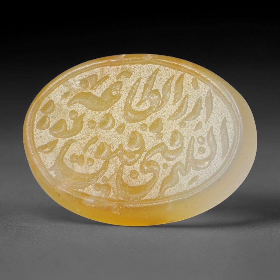 Antique Islamic Qajar / Late Ottoman Agate Calligraphic Talisman Seal (1700-1900 CE), 80FP: Genuine fully hand-carved oval agate seal, entirely crafted by hand without machine tooling, identifiable by organic, uneven hand-cut engraving texture throughout the calligraphic field. The stone bea