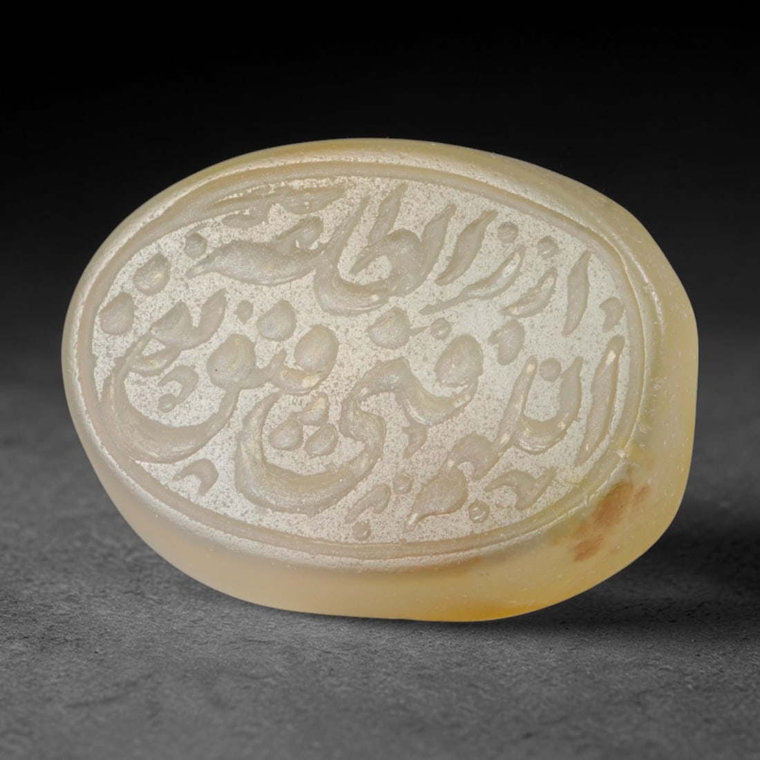 Antique Islamic Qajar / Late Ottoman Agate Calligraphic Talisman Seal (1700-1900 CE), 93FP: Genuine fully hand-carved oval agate seal, entirely crafted by hand without machine tooling, identifiable by organic, uneven hand-cut engraving texture throughout the calligraphic field. The stone bea