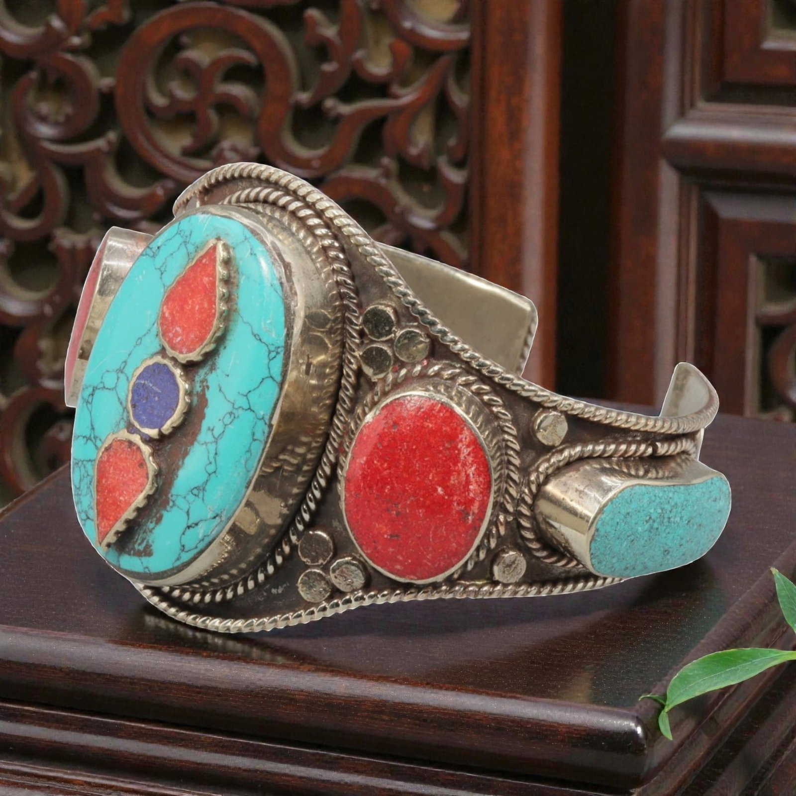 A Vintage Himalayan Silver-Plated Multi-Stone Inlay Cuff Bracelet, 28AH: A handcrafted vintage cuff bracelet, measuring approximately 6 cm in width, showcasing traditional Himalayan jewelry design. The piece features a silver-plated metal base, with a large oval turquoise 