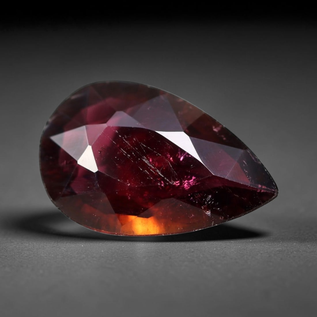 3.15 Carats Natural Mozambique Rubellite Tourmaline Loose Gemstone, 4FM: This natural Mozambique rubellite tourmaline features dimensions of 15x9.6x3.8mm, showcasing rich deep crimson red tones blended with subtle warm orange undertones that emerge when light passes throug