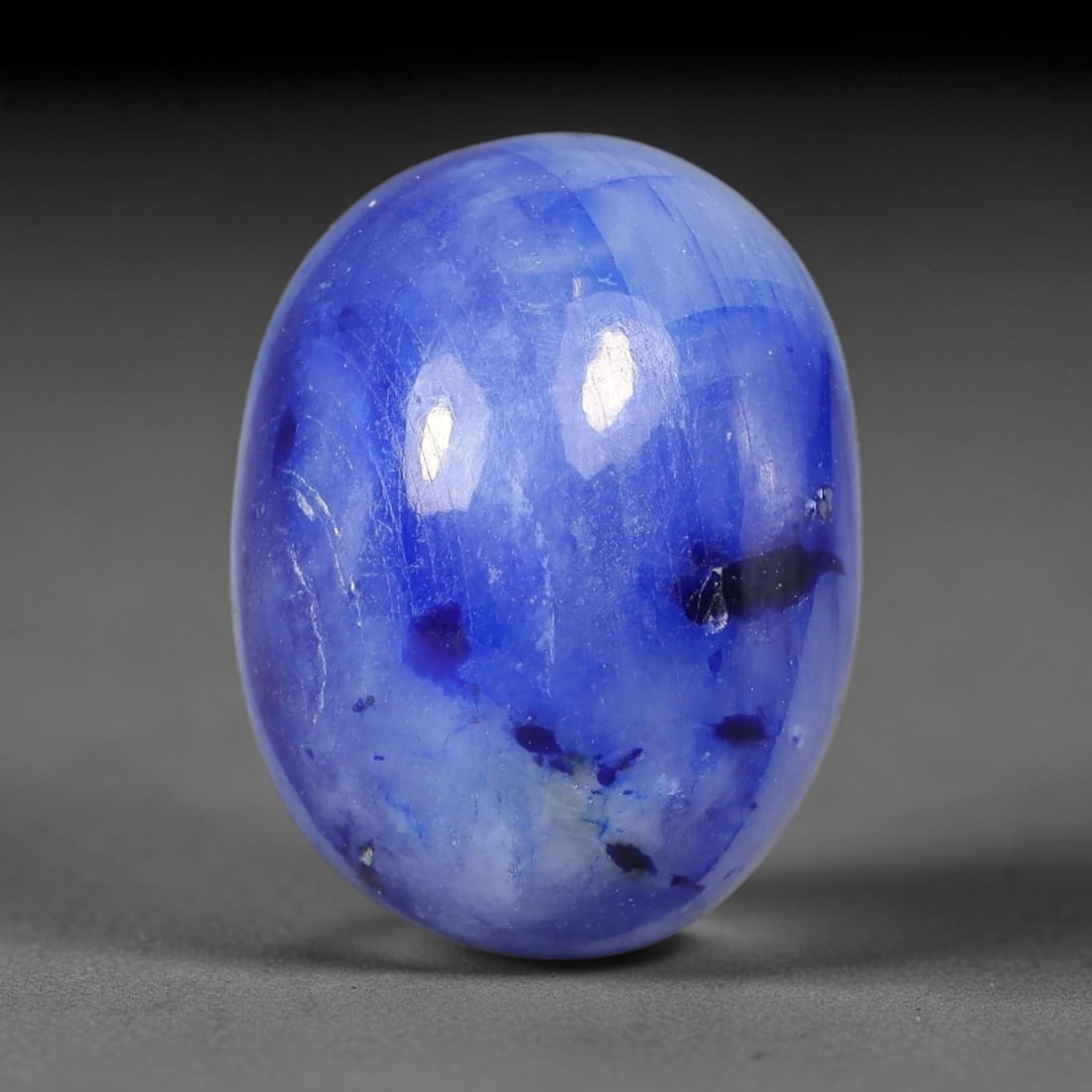 20.27 Carats Natural Madagascar Deep Cobalt Blue Sapphire Loose Gemstone, 21FE: This Madagascar sapphire cabochon has dimensions measuring 16.4x12.6x8.9mm, featuring rich cobalt blue color blended with soft natural pale veining that creates unique layered visual texture across th