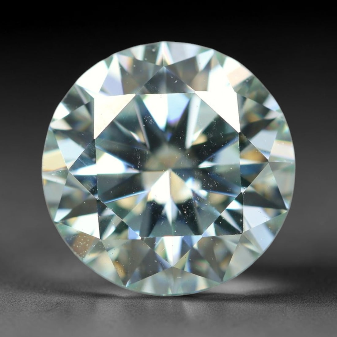 2.55 Carats Natural Cool White Moissanite Loose Gemstone, 1FL: This cool white moissanite holds dimension measurements of 9x5.4mm, delivering exceptional light dispersion that generates vivid rainbow sparkle across its fully transparent body, with faint microscop