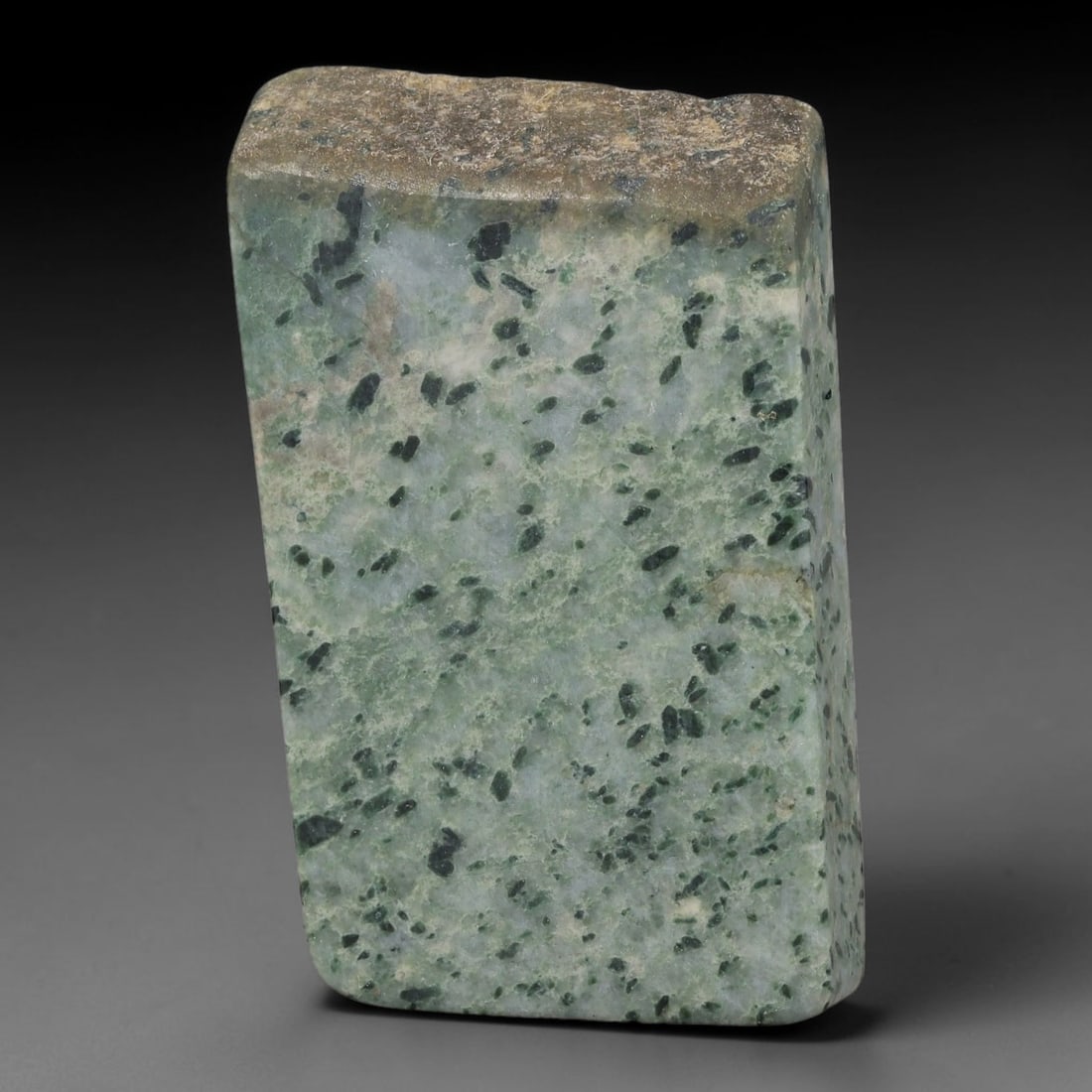 290ct Natural Type A Burmese Jadeite Jade Sliced Rough, 80FB: This specimen is a sliced rough block of natural Type A Burmese jadeite jade. The interior displays natural colour zoning with visible mineral veining and crystalline patterns typical of unprocessed j