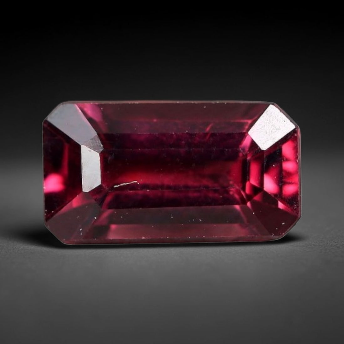 1.17 Carats Natural Mozambique Rich Raspberry Rhodolite Garnet Loose Gemstone, 66FM: This natural Mozambique rhodolite garnet holds dimension measurements of 7.8x4.3x3.4mm, carrying an intense saturated raspberry red hue that radiates vivid tonal flashes through its transparent crysta