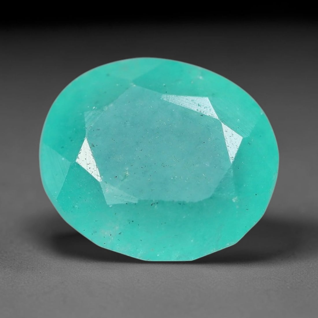 5.76 Carats Natural Brazilian Soft Mint Green Beryl Loose Gemstone, 95FE: This natural Brazilian green beryl measures 11.4x10.2x7mm, presenting a soft uniform mint green tone throughout its translucent crystal matrix, dotted with fine scattered dark mineral specks and subtl