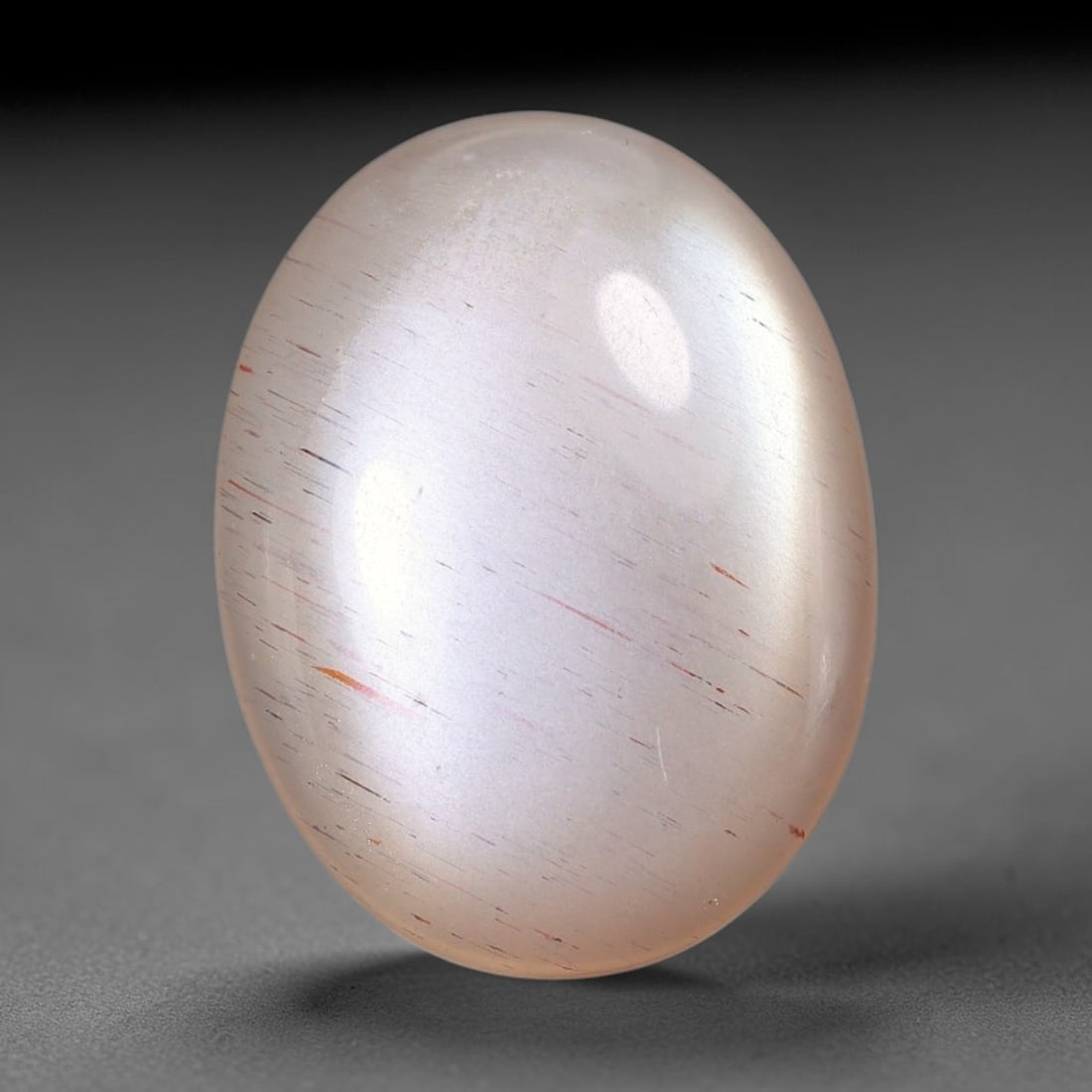 5.66 Carats Natural Ceylon Soft Peach Pink Moonstone Cabochon Loose Gemstone, 2AG: This warm soft peach pink moonstone features delicate sparkling mineral flecks scattered throughout its smooth surface paired with faint flowing adularescent glow, measured at 16.2x12.2x3.6mm, its gen