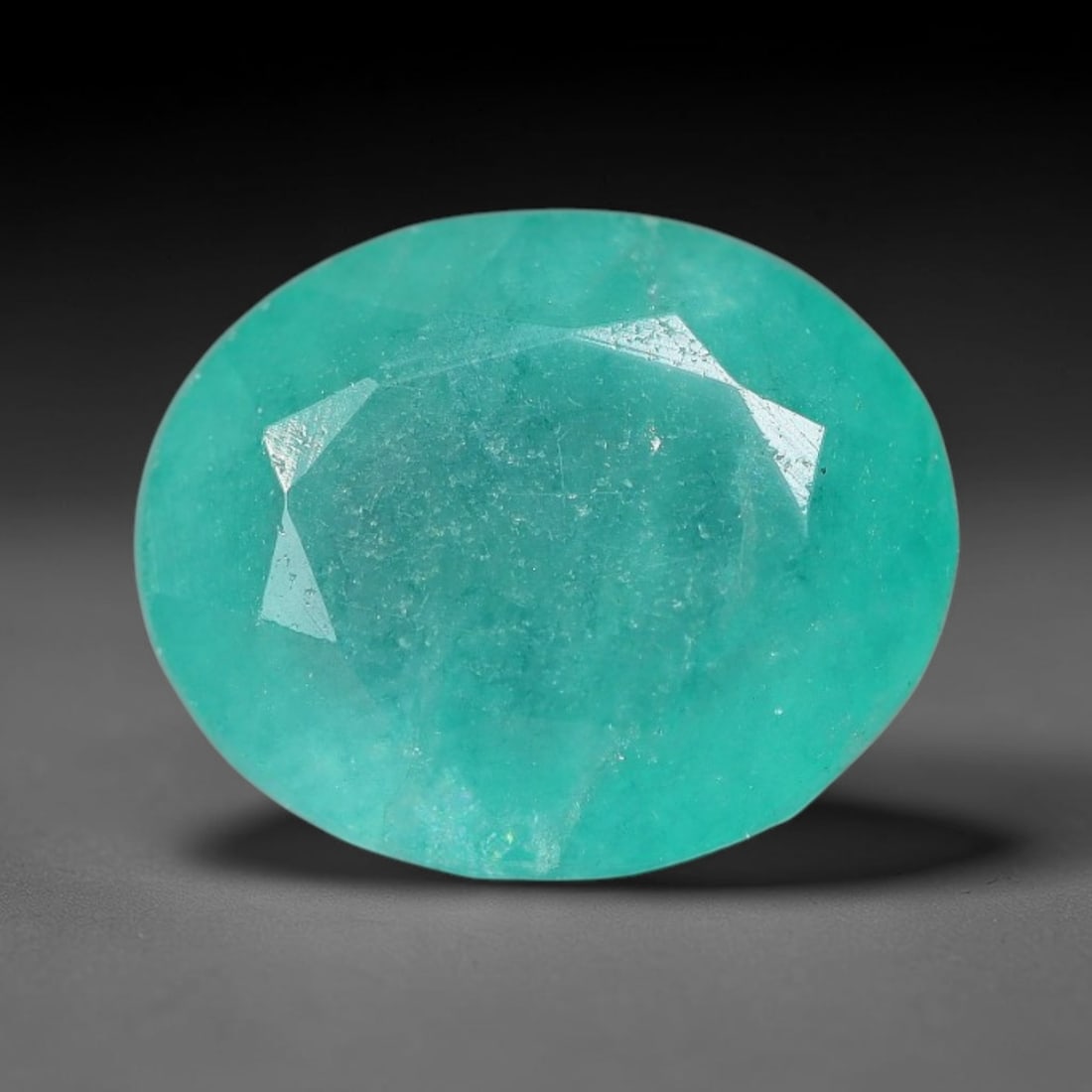 4.57 Carats Natural Brazilian Soft Mint Green Beryl Loose Gemstone, 98FE: This natural Brazilian green beryl measures 11.4x9.4x6.1mm, presenting a soft uniform mint green tone throughout its translucent crystal matrix, dotted with fine scattered dark mineral specks and subt
