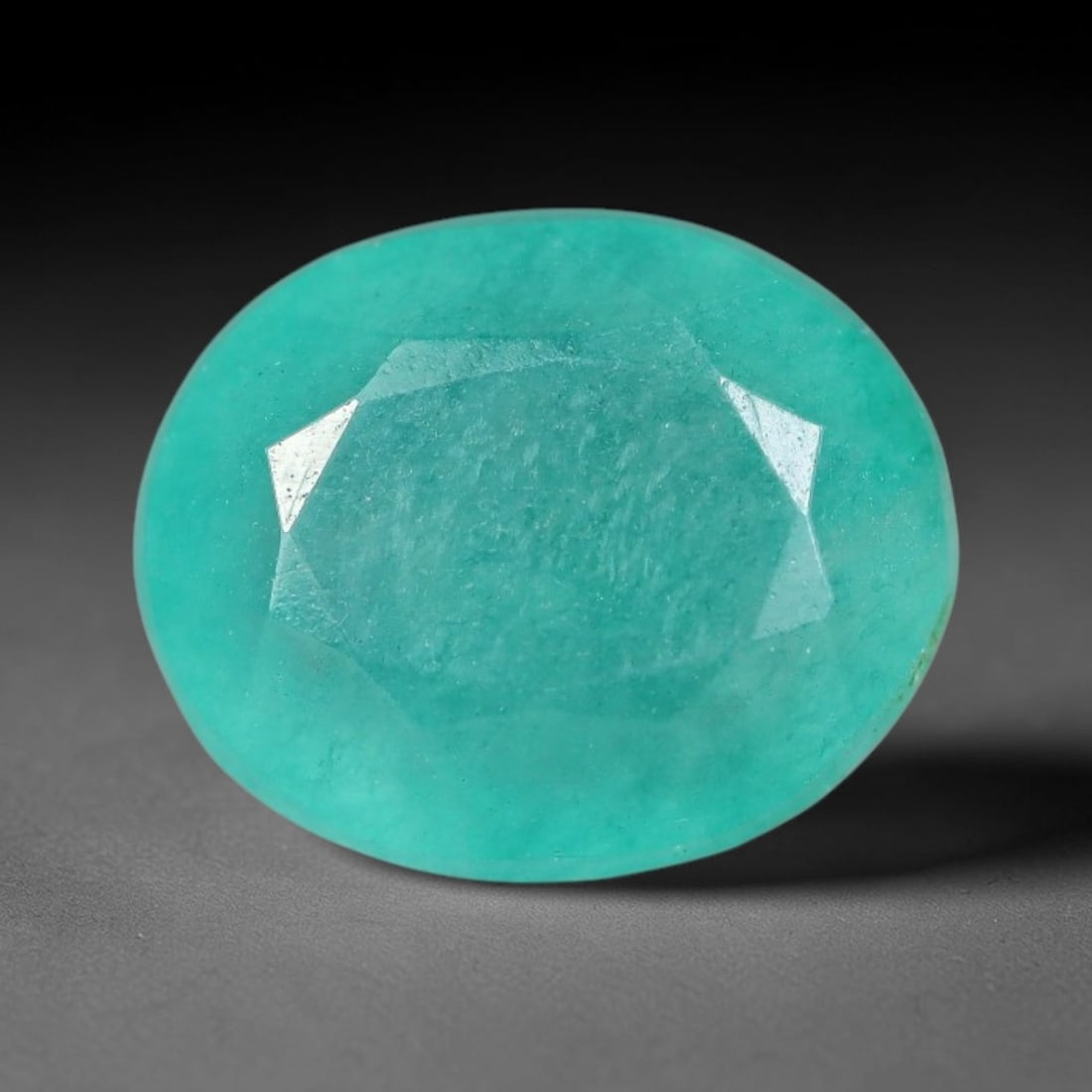 4.90 Carats Natural Brazilian Soft Mint Green Beryl Loose Gemstone, 97FE: This natural Brazilian green beryl measures 11.5x9.5x6mm, presenting a soft uniform mint green tone throughout its translucent crystal matrix, dotted with fine scattered dark mineral specks and subtle
