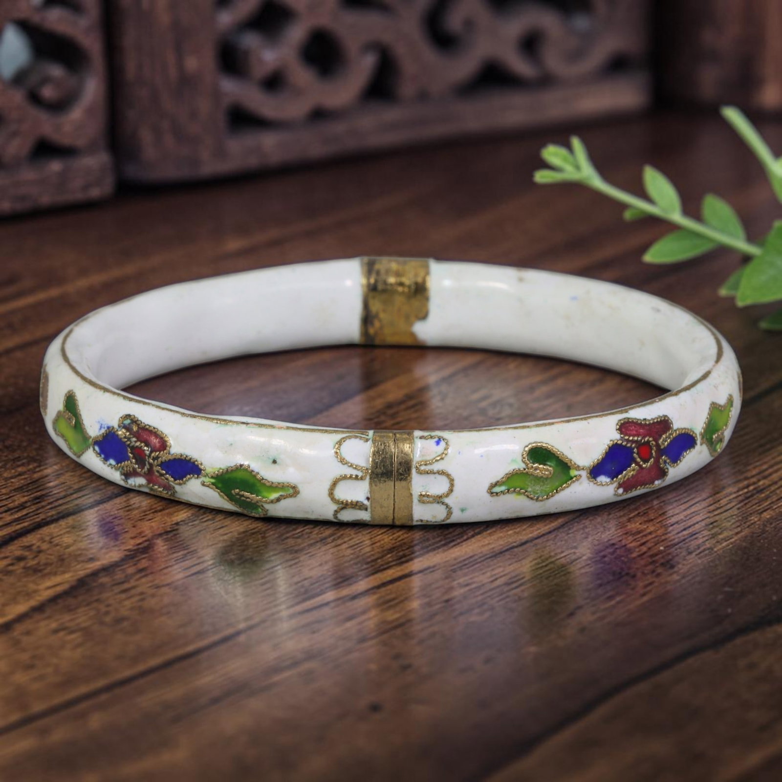 Vintage Chinese Cloisonne Bangle - White Floral Enamel Bracelet, 70FD: Built upon a gilded metal foundation with classic Chinese cloisonne twisted wire filigree craftsmanship, this hinged bangle features an opaque white enamel base adorned with repeating stylized floral 