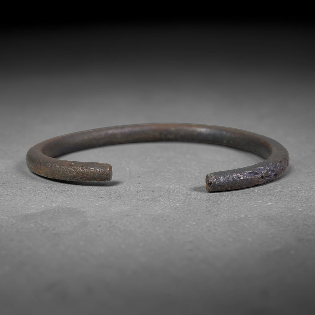Ancient Roman Republic & Imperial Roman Bronze Open Armilla Bracelet (509 BCE-476 CE), 11AC: This antique solid bronze open cuff armilla bracelet originates from Roman Republic & Imperial Roman Culture, widely produced utilitarian and symbolic adornment worn by civilian women and awarded as m