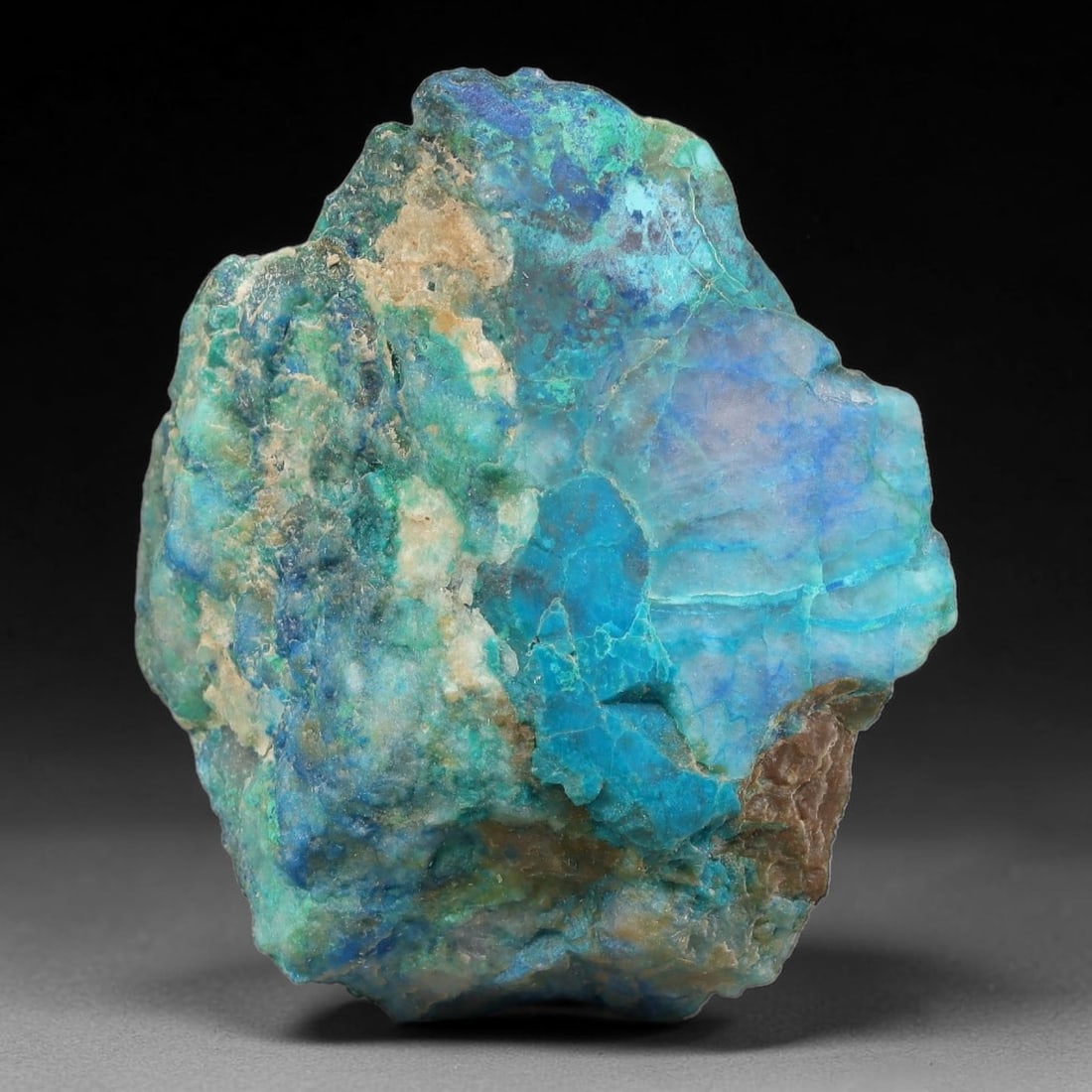 195ct Natural Peruvian Chrysocolla Polished Slab Rough, 77AR: This partial-polished chrysocolla slab features blended mineral matrix with smooth refined face and unaltered natural rugged edge across its 45x38x23mm elongated form, translucent mineral layers hold 
