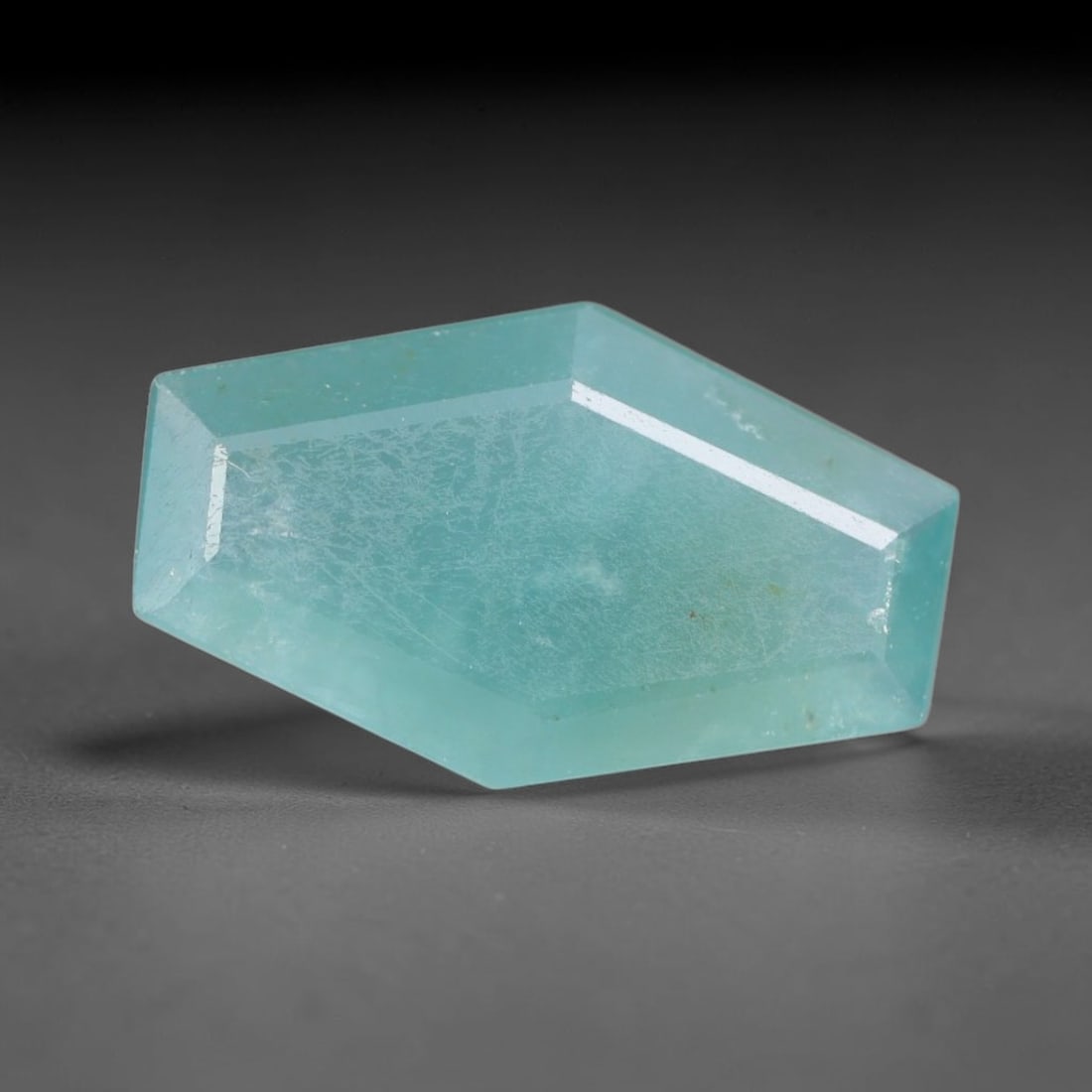 1.31ct Natural Madagascan Faceted Grandidierite Rare Loose Gemstone, 99AS: This expertly faceted finished grandidierite holds soft translucent body tone with fine faint natural internal veining visible beneath precisely cut reflective facets within its 11.5x8.6x2.8mm calibra