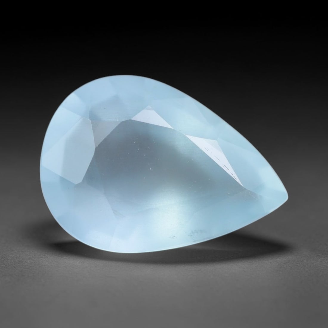 2.23ct Natural Brazilian Soft Sky Blue Faceted Aquamarine Loose Gemstone, 52AS: This expertly faceted aquamarine carries a gentle soft sky blue translucent body with faint fine natural internal mineral markings visible through its polished reflective facets within its 11x7.9x4.6m