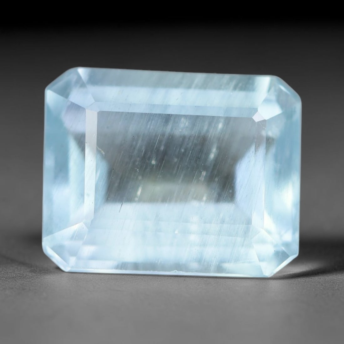 4.55ct Natural Brazilian Soft Sky Blue Faceted Aquamarine Loose Gemstone, 18AS: This expertly faceted aquamarine carries a gentle soft sky blue translucent body with faint fine natural internal mineral markings visible through its polished reflective facets within its 11.5x9.2x5.
