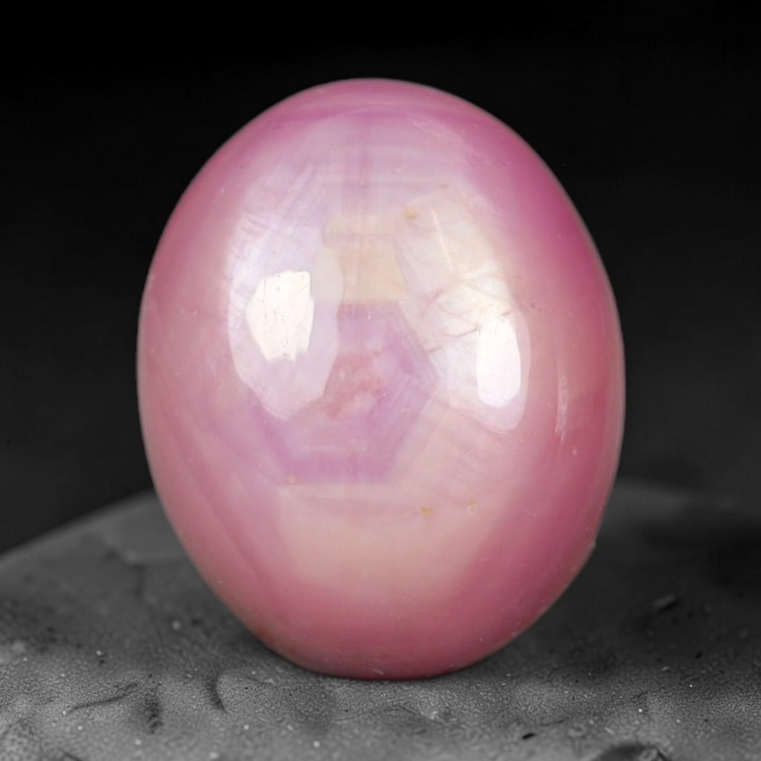 7.37ct Natural Mozambican Soft Bubblegum Pink Ruby Cabochon Loose Gemstone, 96AR: This smoothly polished domed ruby cabochon displays a gentle soft bubblegum pink body tone with faint natural linear mineral veining and tiny scattered rust-hued mineral flecks embedded within its tra