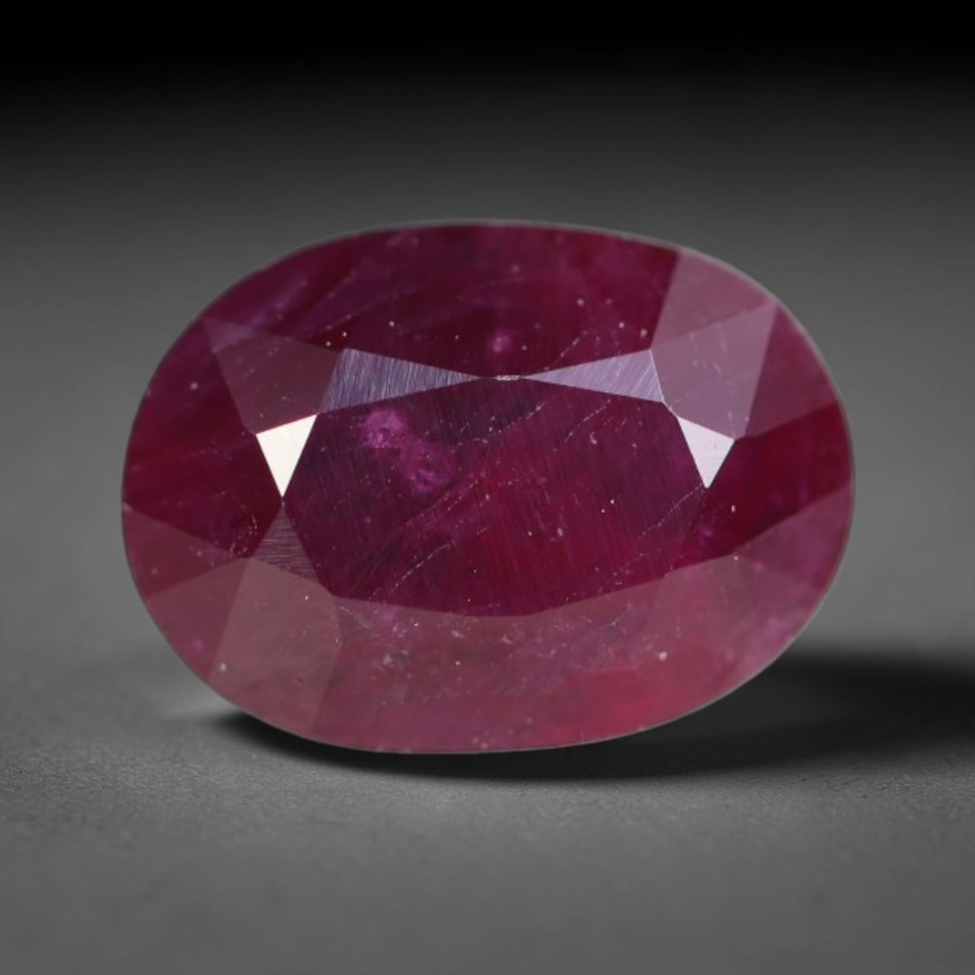 1.14ct Natural Tanzanian Longido Deep Crimson Red Faceted Ruby Loose Gemstone, 22BD: This expertly faceted Longido ruby features a rich deep crimson red body tone with distinct natural linear mineral striations, scattered pale mineral deposits and minor dark mineral flecks visible wit