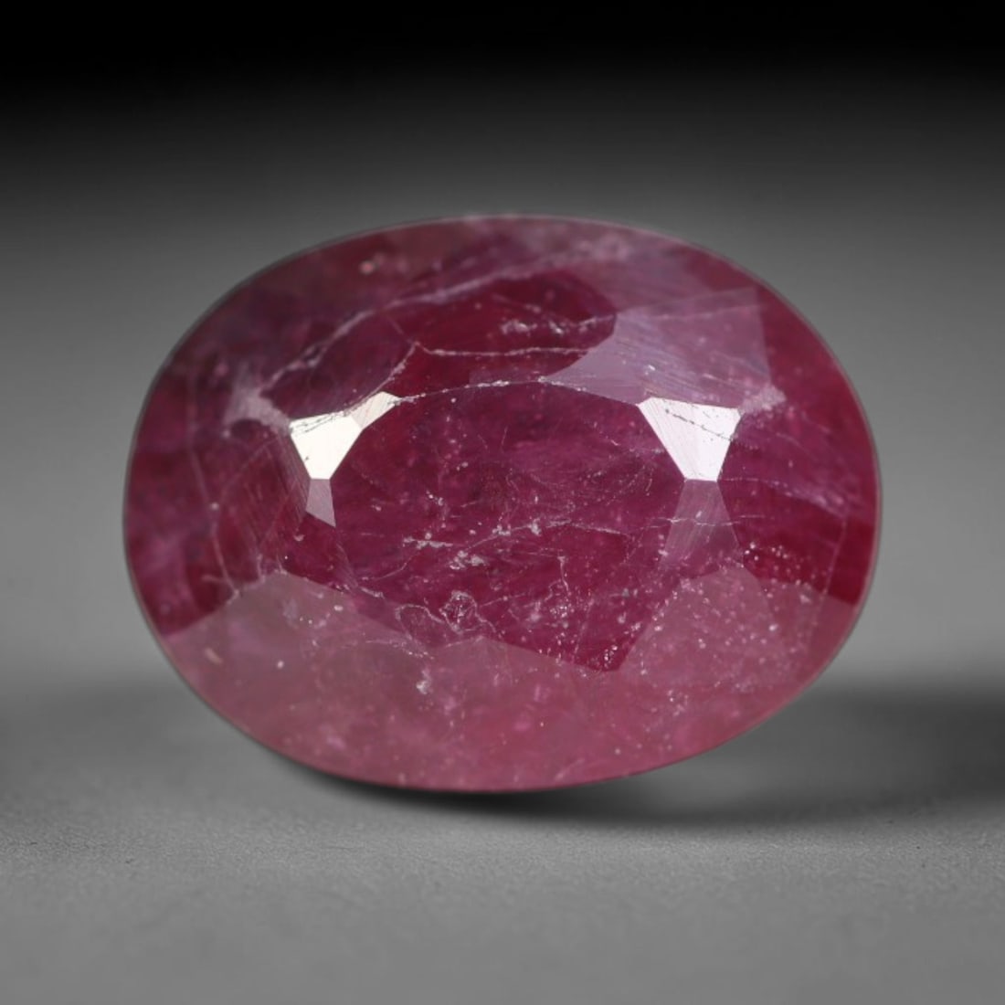 1.55ct Natural Tanzanian Longido Deep Crimson Red Faceted Ruby Loose Gemstone, 15BD: This expertly faceted Longido ruby features a rich deep crimson red body tone with distinct natural linear mineral striations, scattered pale mineral deposits and minor dark mineral flecks visible wit
