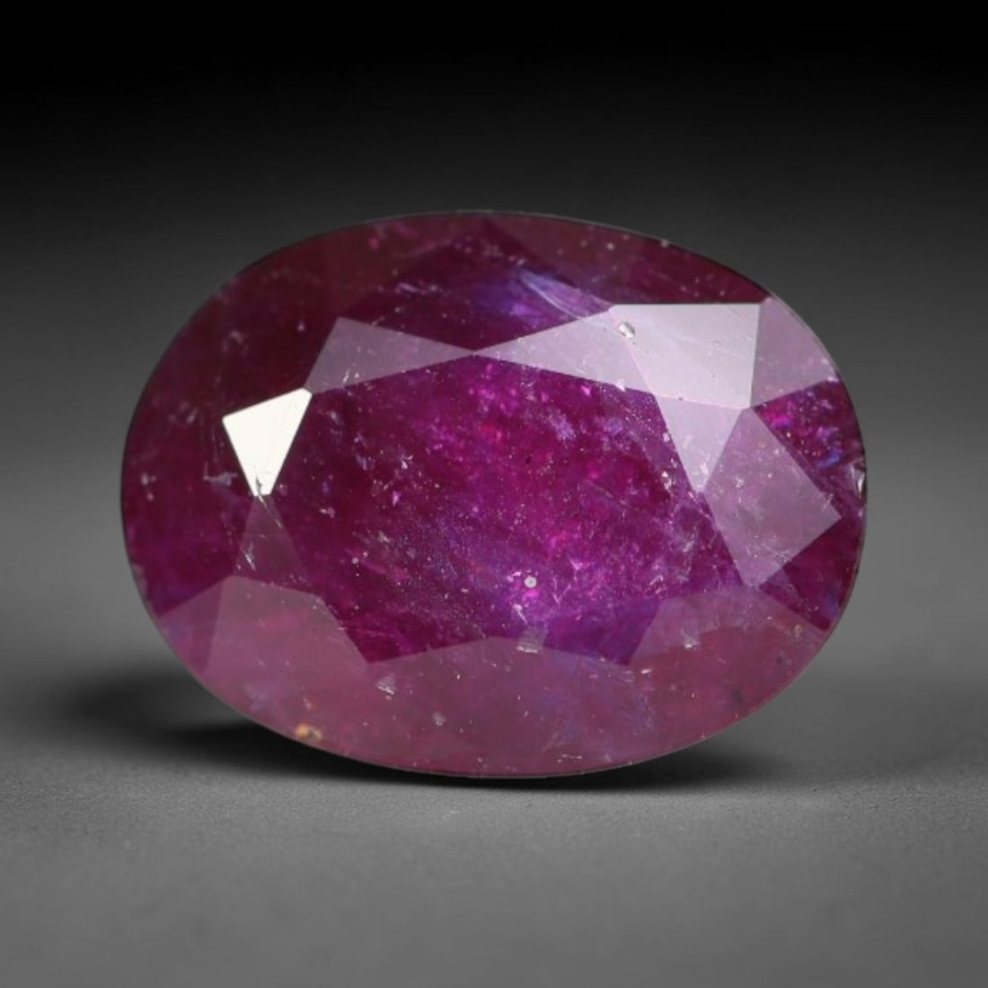 1.68ct Natural Tanzanian Longido Deep Crimson Red Faceted Ruby Loose Gemstone, 82BC: This expertly faceted Longido ruby features a rich deep crimson red body tone with distinct natural linear mineral striations, scattered pale mineral deposits and minor dark mineral flecks visible wit