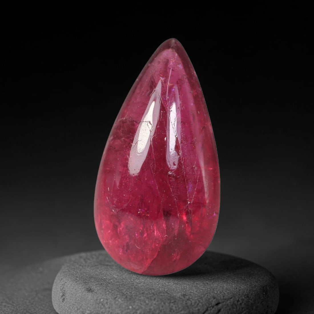 4.01ct Natural Brazilian Rubellite Tourmaline Cabochon Loose Gemstone, 4BC: This smoothly polished cabochon rubellite tourmaline features layered saturated pink-red body saturation with dense natural crystalline mineral flecks and fine internal fracture markings concentrated 