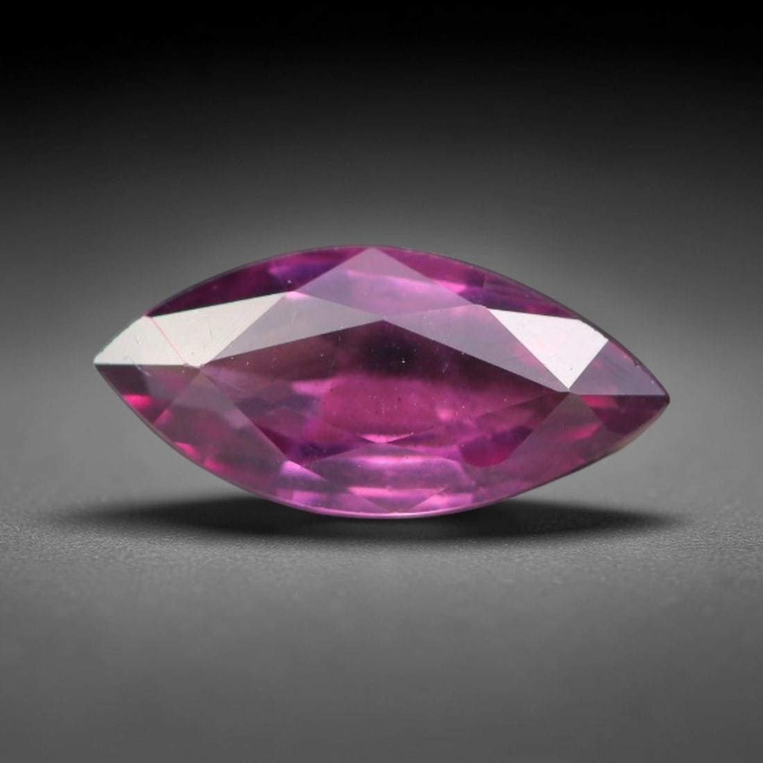 1.14ct Natural Tanzanian Rhodolite Grape Garnet Faceted Loose Gemstone, 80BA: This expertly faceted grape garnet, a scarce saturated purple-magenta rhodolite variant, features transparent crystal structure dotted with faint microscopic mineral specks within its precisely cut re