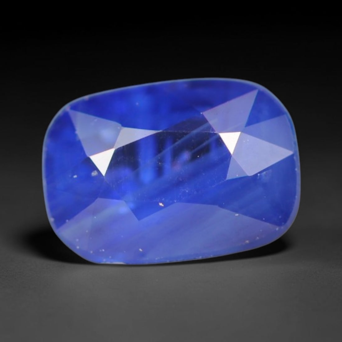 0.97ct Natural Ceylon Rich Royal Blue Faceted Blue Sapphire Loose Gemstone, 41BC: This fully polished finished sapphire displays rich saturated royal blue body tone, with fine natural microscopic mineral specks scattered throughout its transparent crystal interior within its 6.6x4.