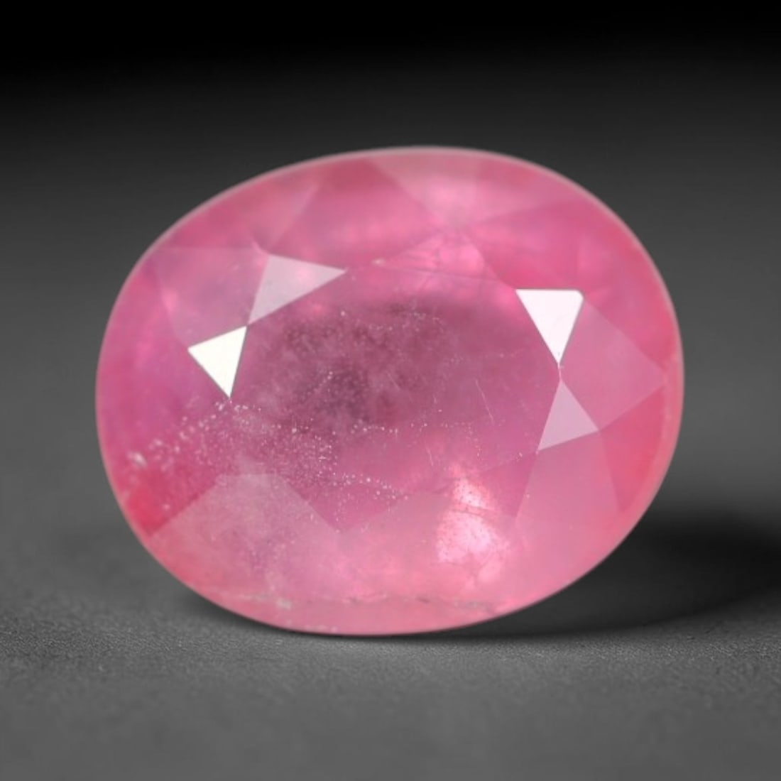 0.99ct Natural Sri Lankan Padparadscha Sapphire Loose Gemstone, 72BC: This fully polished Padparadscha sapphire carries warm blended peach-pink and soft orange body saturation, with subtle microscopic mineral flecks dispersed within its crystalline interior across its c