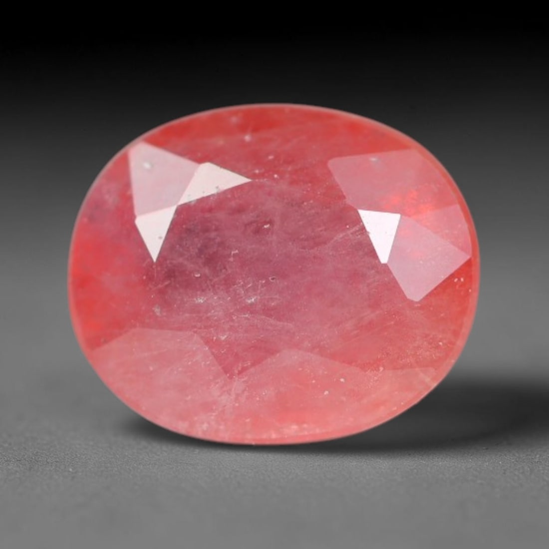 0.90ct Natural Sri Lankan Padparadscha Sapphire Loose Gemstone, 56BC: This fully polished Padparadscha sapphire carries warm blended peach-pink and soft orange body saturation, with subtle microscopic mineral flecks dispersed within its crystalline interior across its c