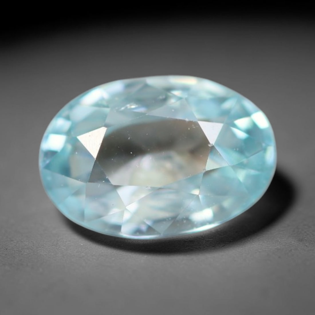 1.00ct Natural Cambodian Sky Blue Blue Zircon Loose Gemstone, 15BA: This fully polished blue zircon carries a gentle pale sky blue body tone with tiny microscopic mineral specks dispersed within its high-dispersion crystal interior, measured at calibrated dimensions o