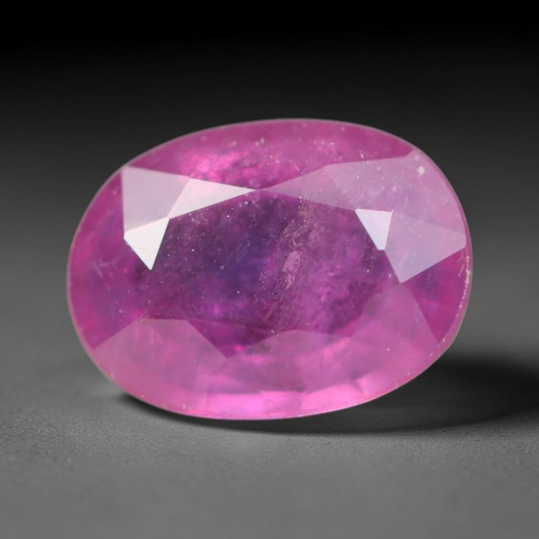 0.78ct Natural Sri Lankan Padparadscha Sapphire Loose Gemstone, 55BC: This fully polished Padparadscha sapphire carries warm blended peach-pink and soft orange body saturation, with subtle microscopic mineral flecks dispersed within its crystalline interior across its c