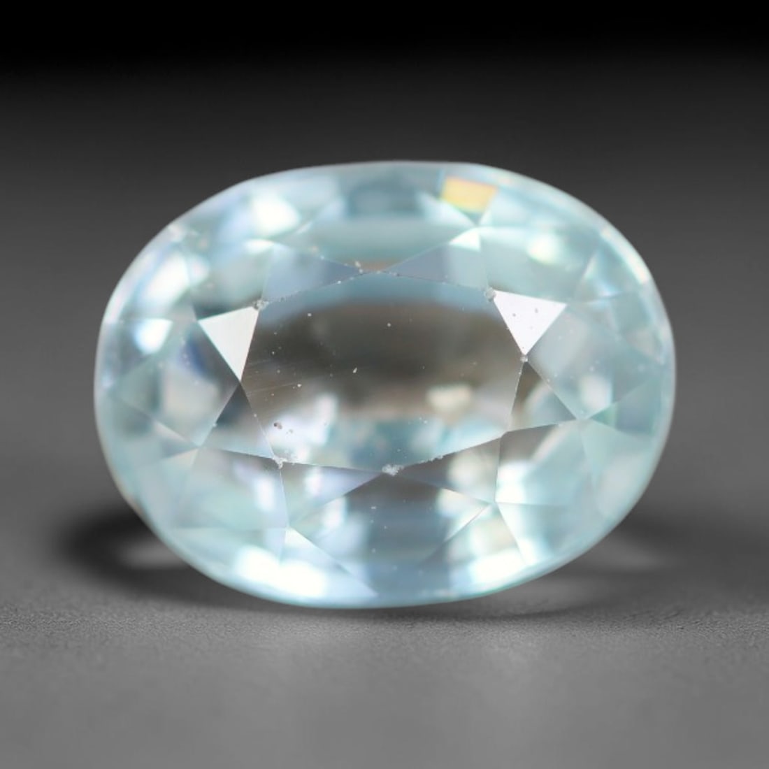 1.61ct Natural Cambodian Sky Blue Blue Zircon Loose Gemstone, 19BA: This fully polished blue zircon carries a gentle pale sky blue body tone with tiny microscopic mineral specks dispersed within its high-dispersion crystal interior, measured at calibrated dimensions o