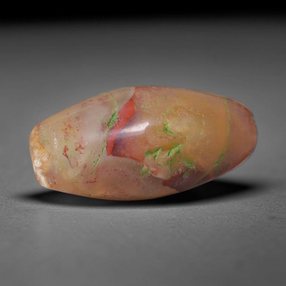 Ancient Western Zhou Dynasty Multi-Colored Inclusion Agate Barrel Bead (1046-771 BCE), 2AE: This antique translucent agate barrel bead originates from China's Western Zhou Dynasty, a pivotal early Chinese civilization with sophisticated stoneworking traditions that crafted precious stone orn