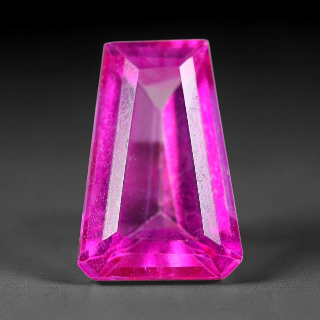 8.95 Carats Natural Brazil Hot Pink Topaz Loose Gemstone, 20FE: This natural Brazil topaz holds dimension measurements of 16x10.8x6.3mm, displaying an intense vibrant hot pink shade created through surface color coating treatment, its transparent crystal body carr