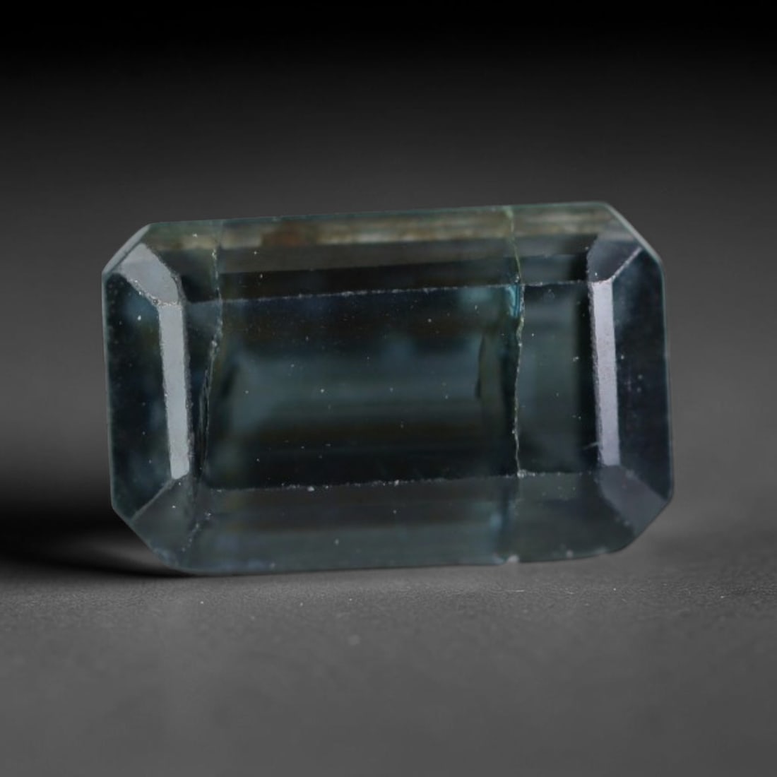 1.24 Carats Natural Mozambique Indigo Blue Tourmaline Loose Gemstone, 39AK: This transparent Mozambique tourmaline features a muted cool indigo blue hue, with tiny scattered natural mineral micro specks and faint subtle internal fine lines throughout the crystal, dimensions 7