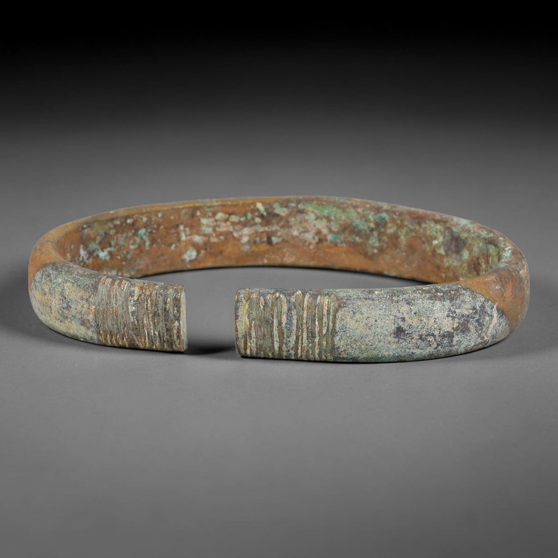 Ancient Roman Solid Bronze Bangle Bracelet, 95AC: Antique wearable circlet hand-forged from solid bronze alloy metal, originating from classical Roman provincial craft and personal adornment traditions across the ancient Mediterranean sphere. Bronze 