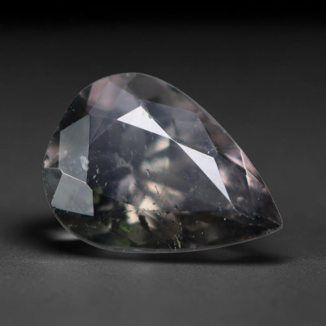 0.94 Carats Natural Mozambique Smoky Bi-Color Tourmaline Loose Gemstone, 38AK: This transparent Mozambique tourmaline features muted smoky grey tones with subtle faint color zoning, scattered natural dark mineral needle inclusions and minor internal fissures throughout the cryst