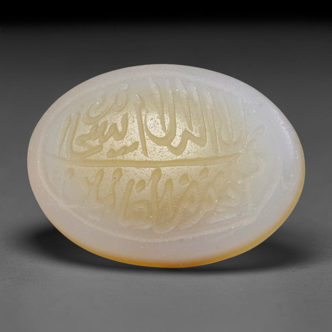 Antique Islamic Qajar / Late Ottoman Agate Calligraphic Talisman Seal (1700-1900 CE), 71FP: Genuine fully hand-carved oval agate seal, entirely crafted by hand without machine tooling, identifiable by organic, uneven hand-cut engraving texture throughout the calligraphic field. The stone bea