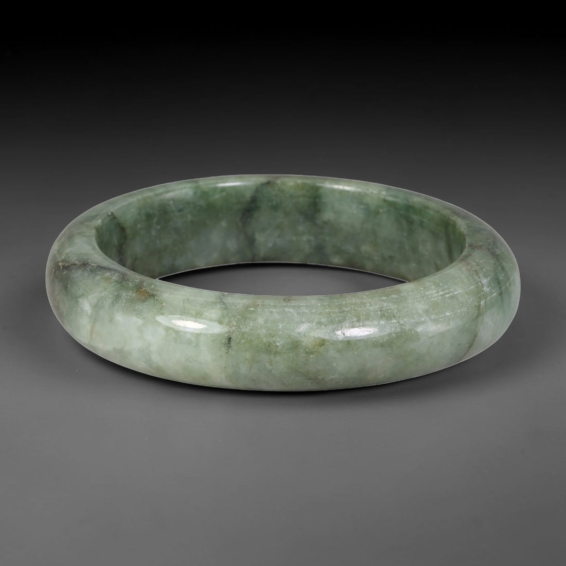 Natural Burmese Type A Uniform Muted Sage Green Jadeite Jade Bangle, 96FD: Crafted from natural untreated Burmese Type A jadeite jade, this tiny compact bangle features an even soft sage green tone with faint natural mineral veining forming understated Moss in Snow texture. 