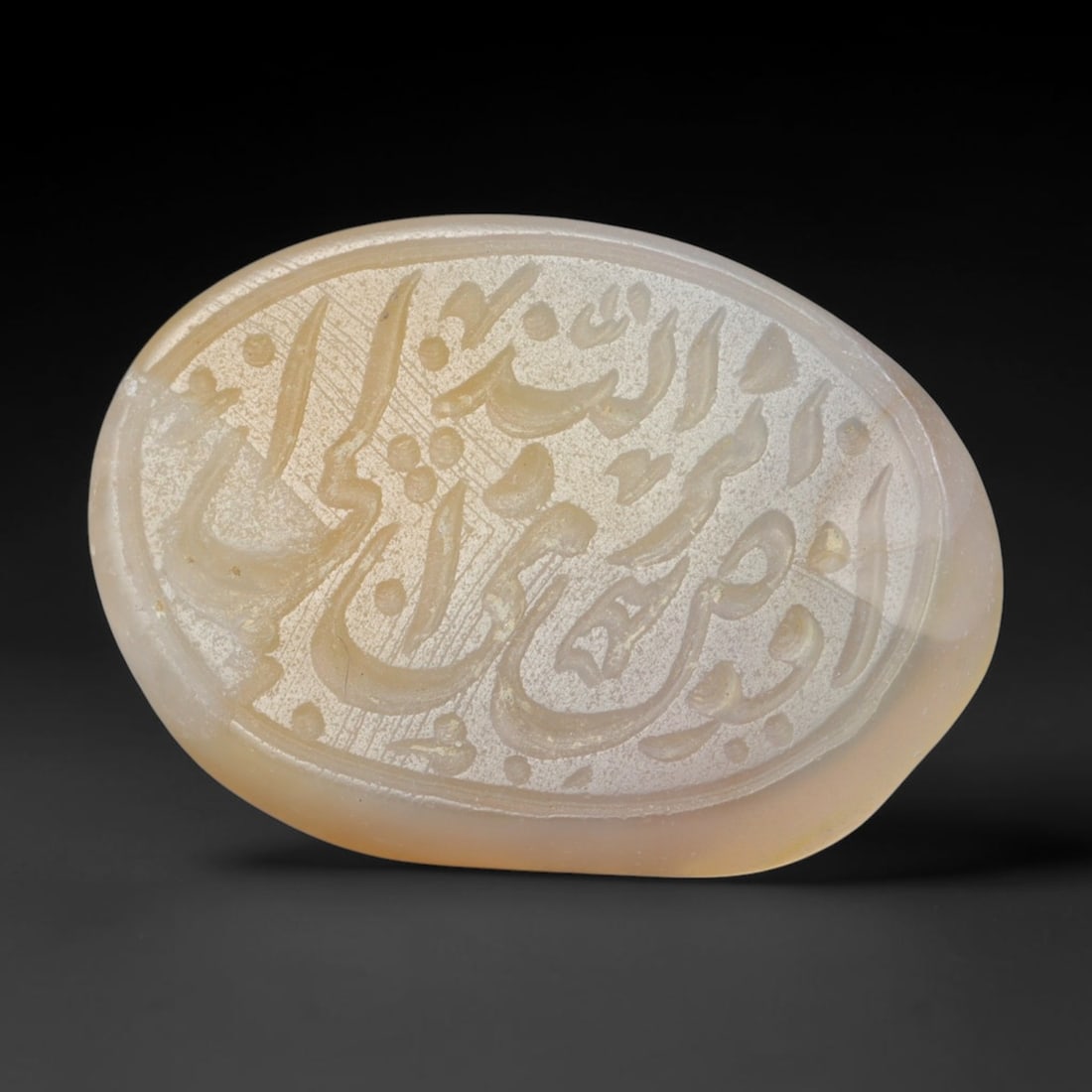 Antique Islamic Qajar / Late Ottoman Agate Calligraphic Talisman Seal (1700-1900 CE), 91FP: Genuine fully hand-carved oval agate seal, entirely crafted by hand without machine tooling, identifiable by organic, uneven hand-cut engraving texture throughout the calligraphic field. The stone bea
