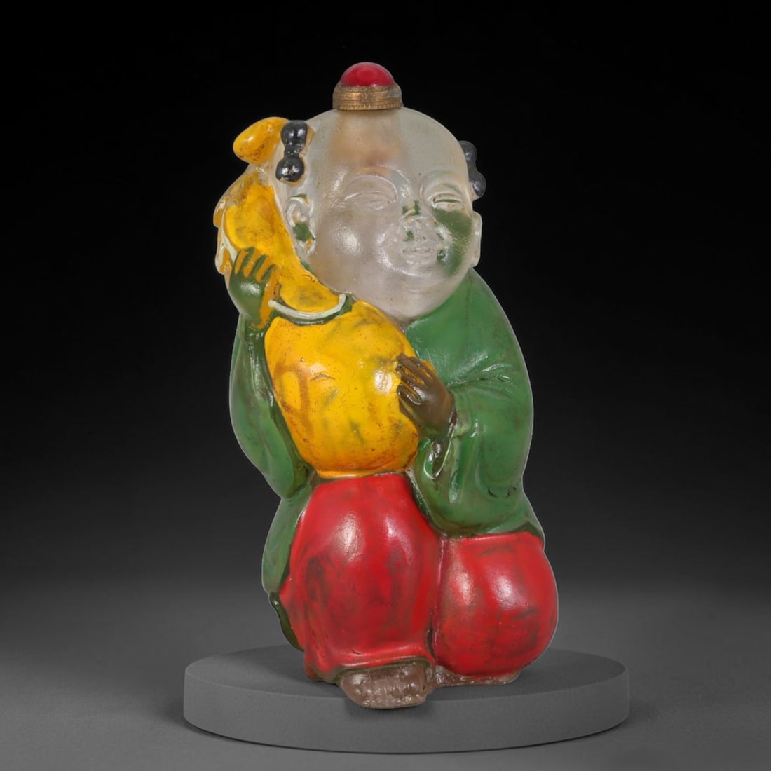 Vintage Chinese Hand Painted Clear Liuli Glass Snuff Bottle, 55AS: This fully sculpted anthropomorphic snuff bottle is molded from translucent frosted clear vintage Chinese liuli glass, shaped as a plump kneeling traditional Chinese child figure with peacefully close