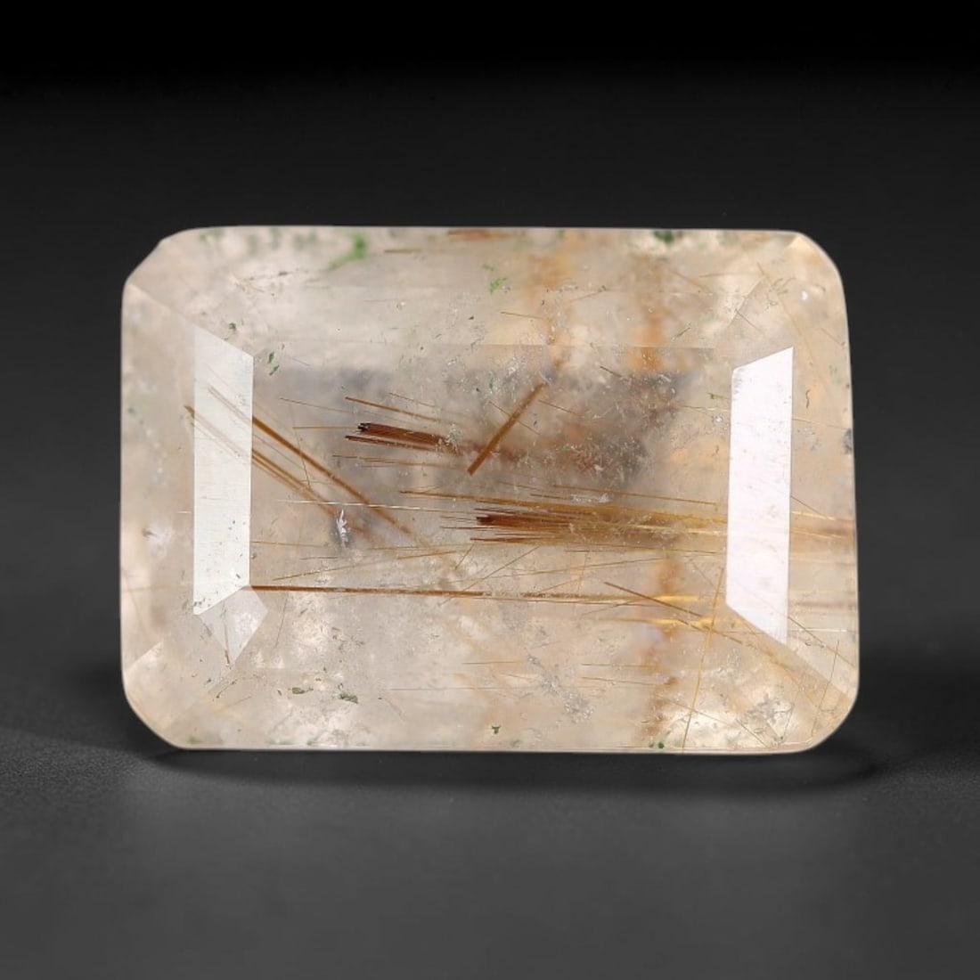 7.34 Carats Natural Brazil Golden Needle Rutile Quartz Loose Gemstone, 60FG: This natural Brazil golden needle rutile quartz facet carries dimension readings of 13.5x9.6x7.5mm, filled with dense thin copper-gold rutile needle inclusions that stretch horizontally across the tra