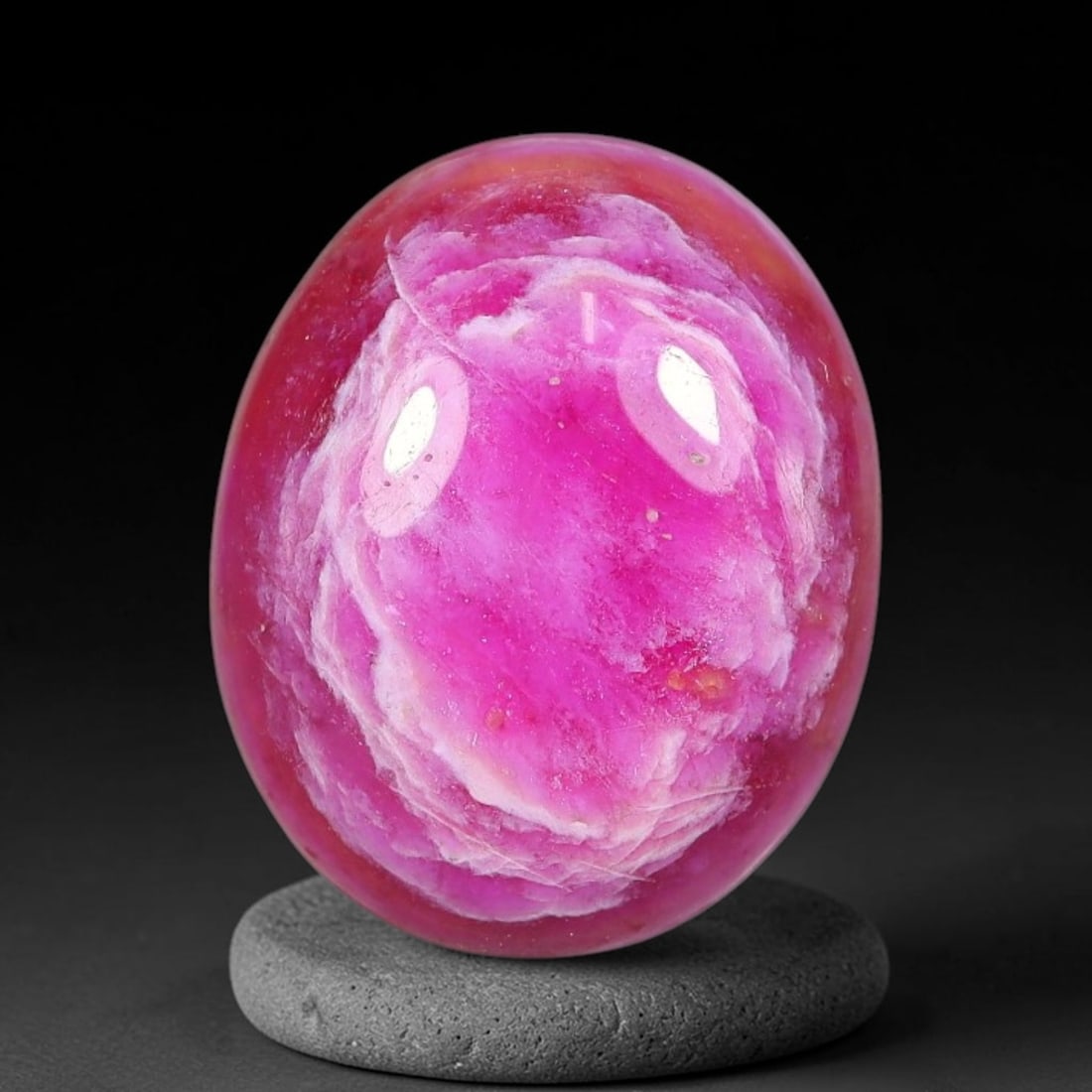 9.75 Carats Natural Mozambique Vivid Pink Red Ruby Loose Gemstone, 80FG: This polished Mozambique ruby cabochon measures 14.3x11.5x5mm, featuring striking natural swirling white mineral banding layered across a rich saturated pink red base that creates a unique organic art