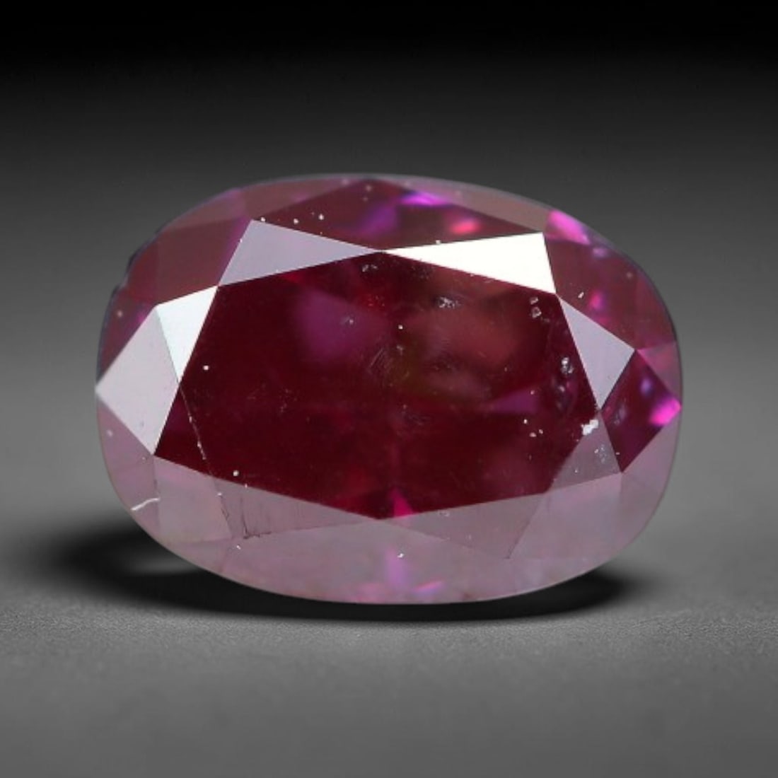 0.25ct Natural Fancy Deep Pink Diamond Loose Gemstone, 33BH: This polished natural fancy diamond features rich deep pink colouration, measured at calibrated dimensions of 4.2x3x2.2mm. Carefully proportioned pear faceting delivers dynamic light movement, highlig