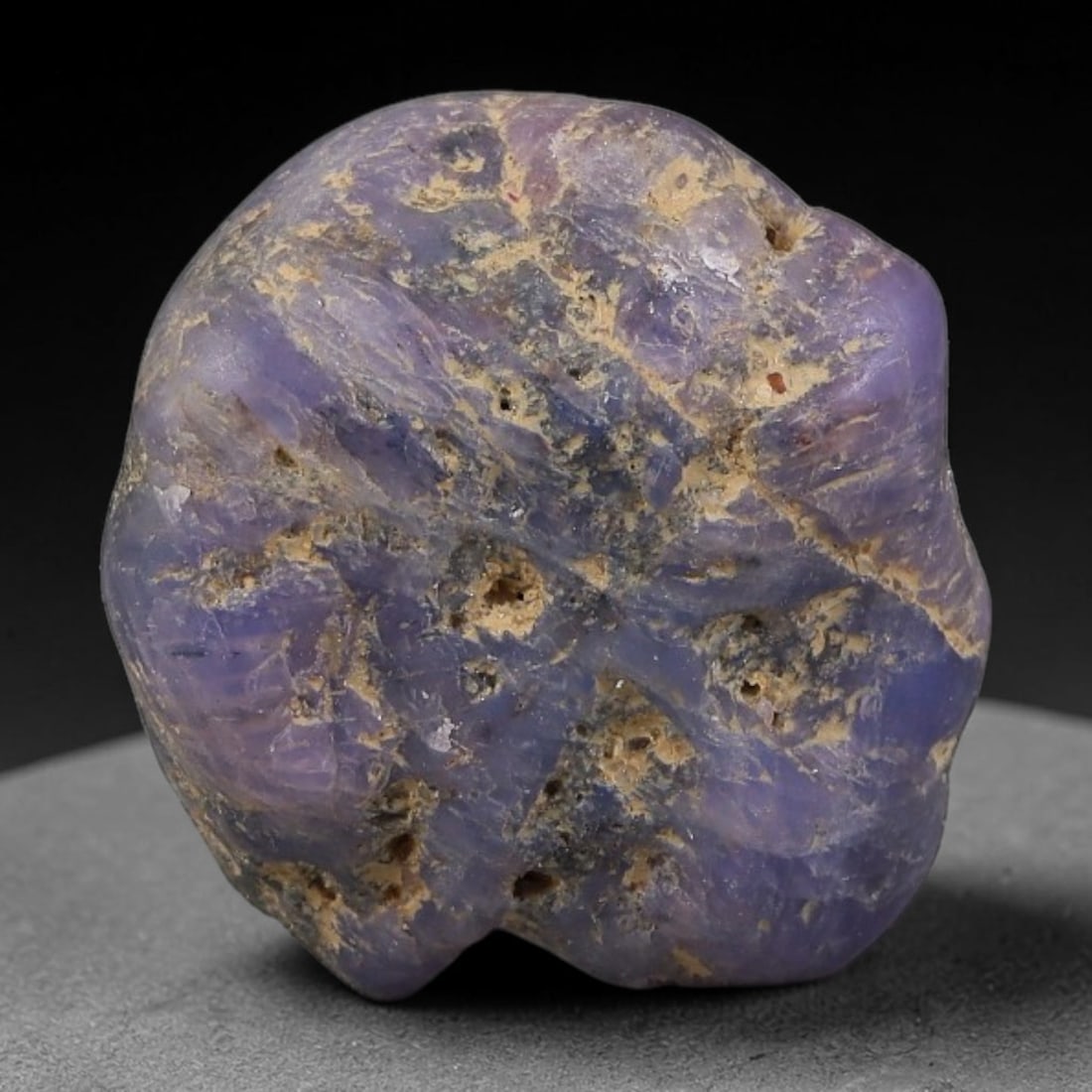 39ct Natural Unheated Sri Lankan Purplish Blue Sapphire Rough, 41FC: This natural corundum rough is an unheated purplish blue sapphire sourced from Sri Lankan alluvial gem deposits, featuring an irregular natural native form with residual pale yellow-brown mineral matr