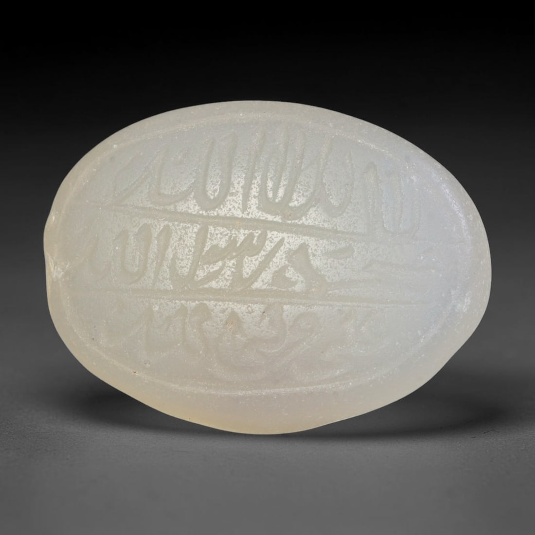 Antique Islamic Qajar / Late Ottoman Agate Calligraphic Talisman Seal (1700-1900 CE), 69FP: Genuine fully hand-carved oval agate seal, entirely crafted by hand without machine tooling, identifiable by organic, uneven hand-cut engraving texture throughout the calligraphic field. The stone bea