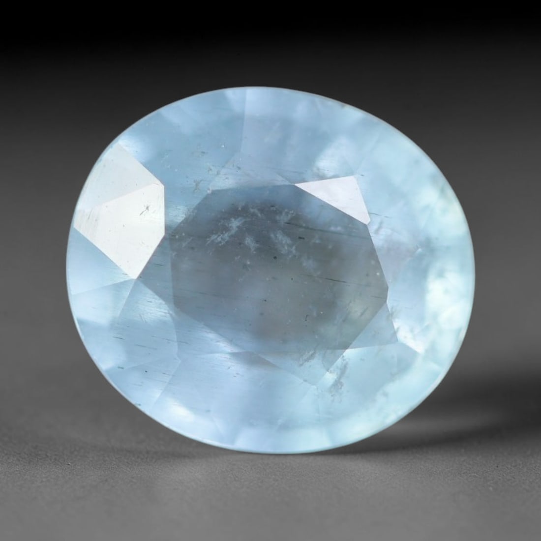 2.45ct Natural Brazilian Soft Sky Blue Faceted Aquamarine Loose Gemstone, 4AS: This expertly faceted aquamarine carries a gentle soft sky blue translucent body with faint fine natural internal mineral markings visible through its polished reflective facets within its 9.3x8.3x4.9