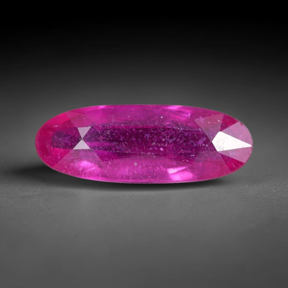 3.22 Carats Natural Madagascar Vivid Fuchsia Red Heated Ruby Loose Gemstone, 32FM: This vivid fuchsia red Madagascar ruby displays rich saturated red tone with subtle natural internal mineral traces that showcase genuine earth-grown character, measured at 14.8x5.5x4mm, the intense w